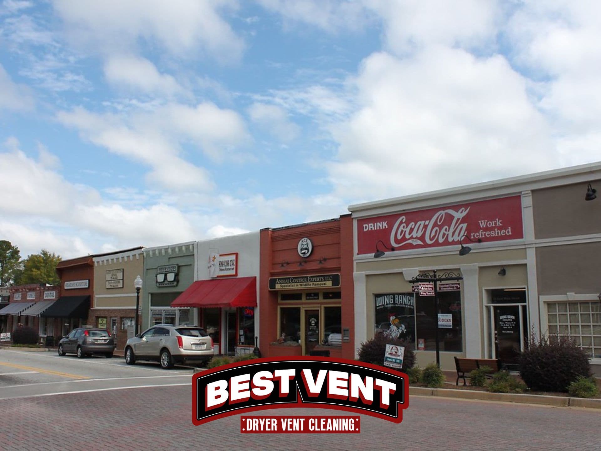 Colorful row of small-town storefronts with a Best Vent dryer vent cleaning logo overlay.
