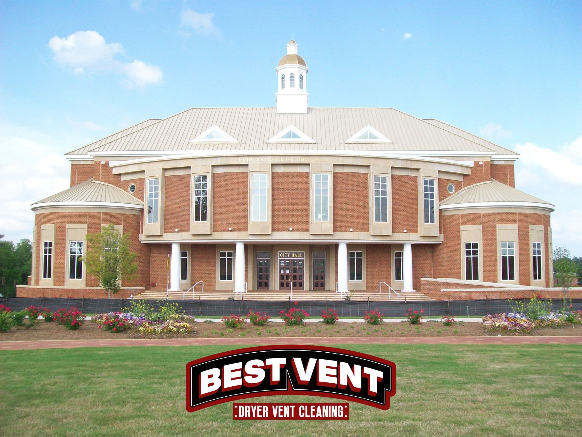 Brick municipal building with white columns and cupola, featuring a Best Vent company logo overlay.