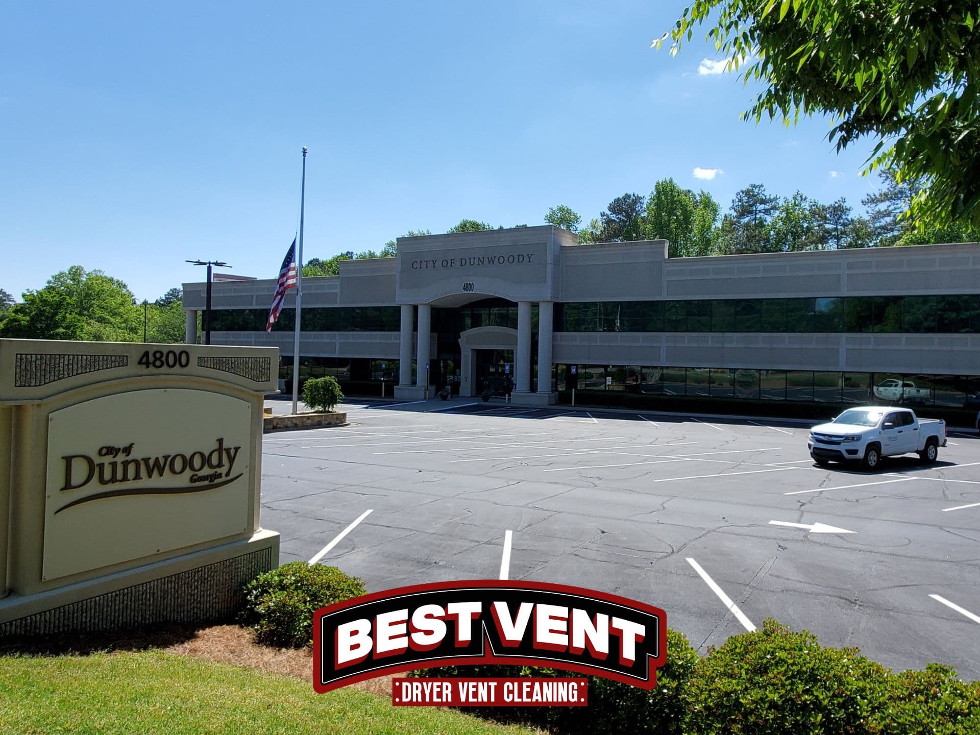 City of Dunwoody building and sign featuring a Best Vent Dryer Vent Cleaning logo.